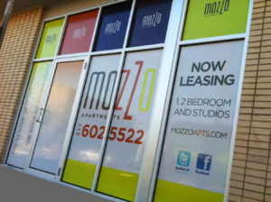 Signworks advertising window signage for Mozzo apartments and leasing.
