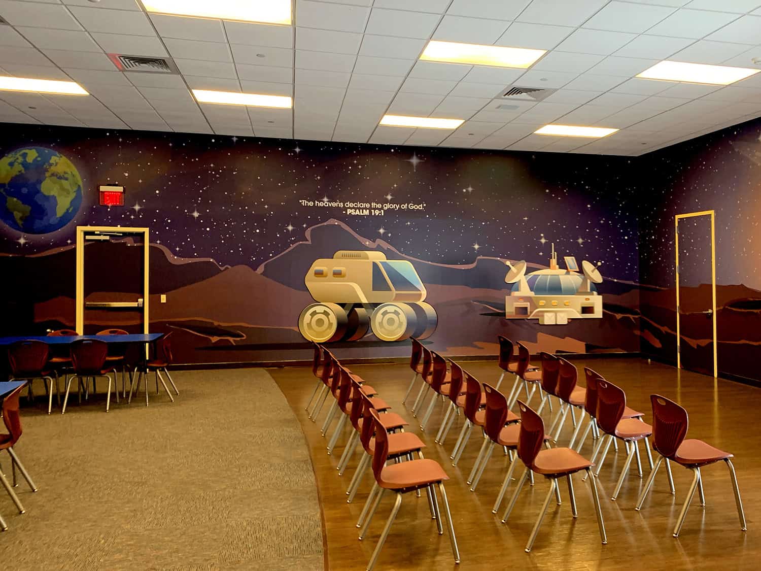 Earth-themed space mural with rockets and planets, ideal for educational or astronomical settings.