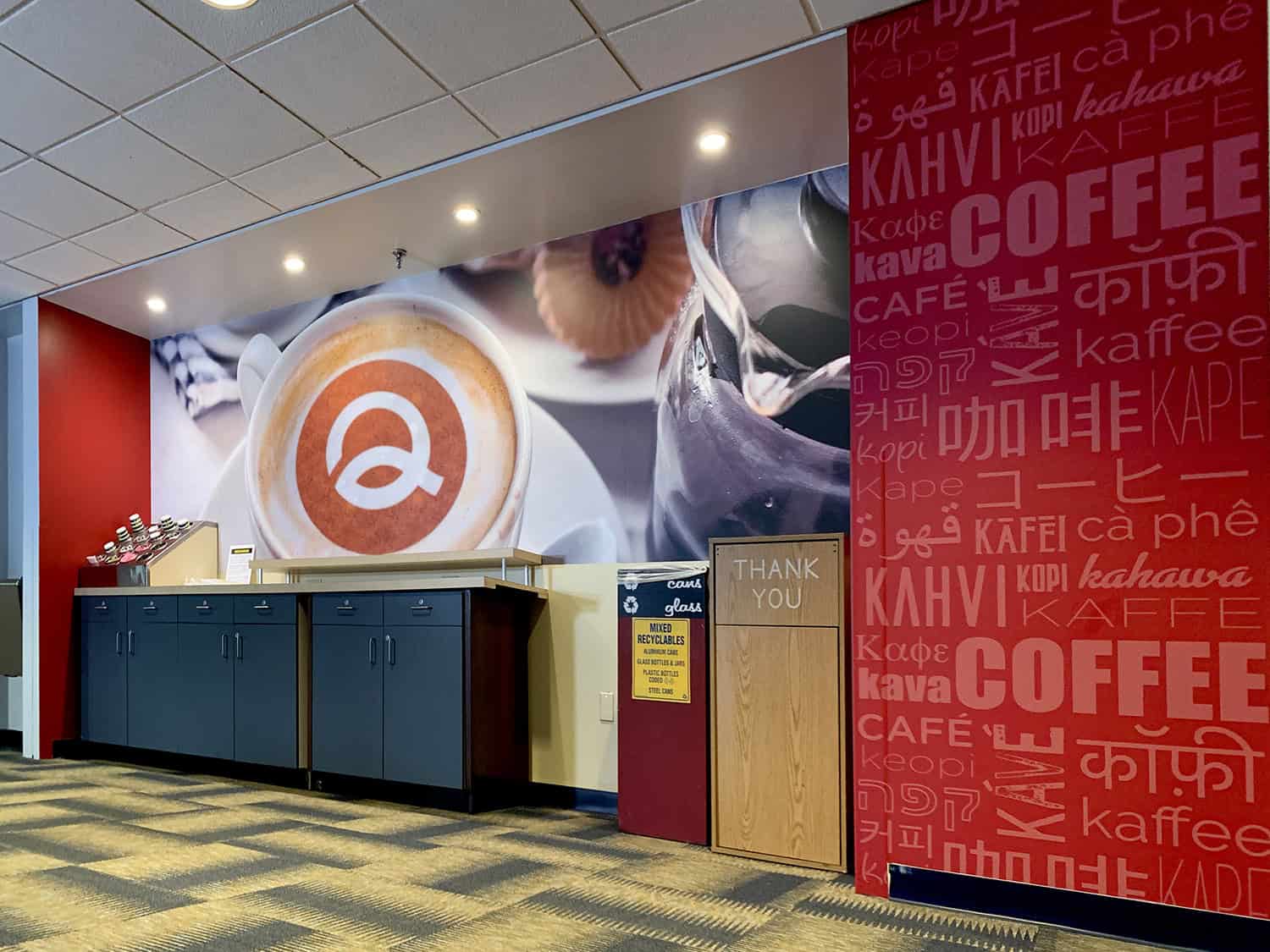Coffee shop interior wall signage with vibrant graphics and branding.