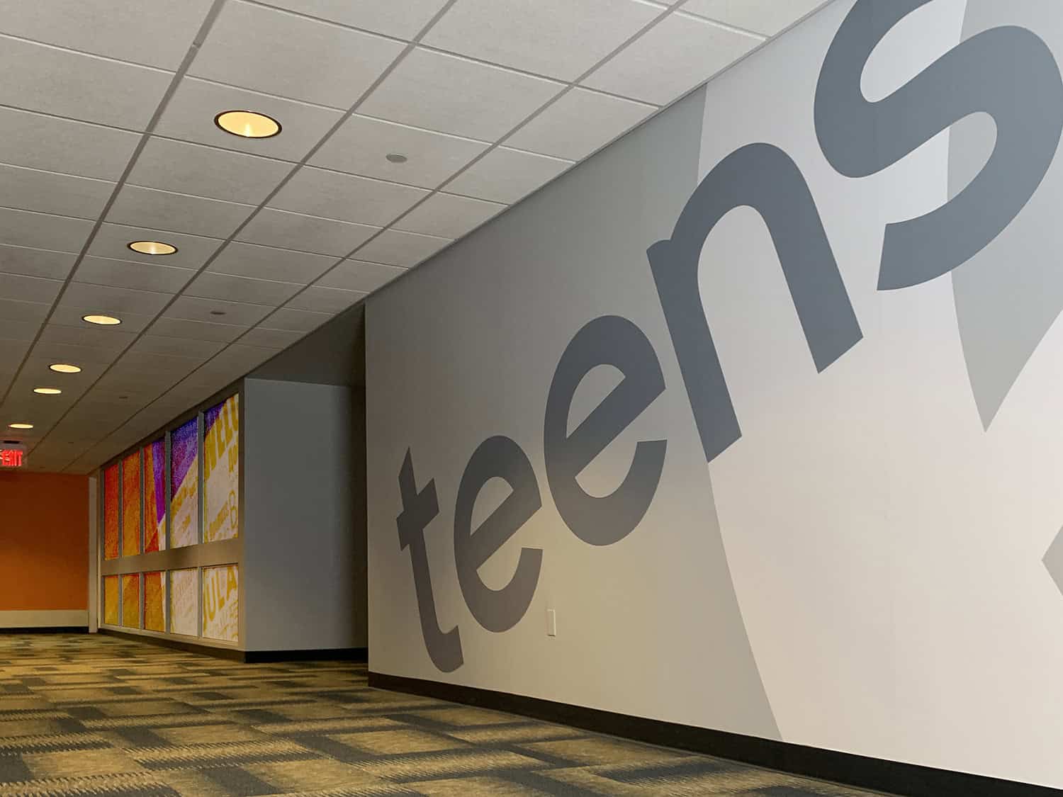 Large corporate signage wall with "telecom" logo and branding for interior decor.