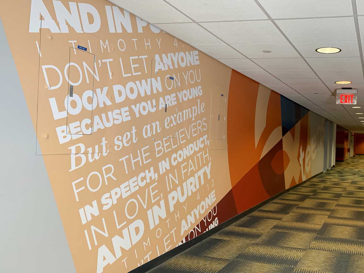 Inspirational quote wall graphic with church faith message, modern sign design, vibrant orange colours, Signworks signage solutions, custom wall decals.