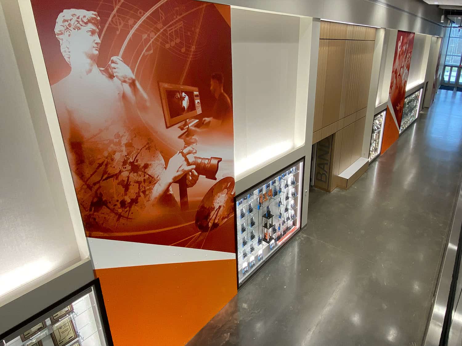 Colourful modern wall sign installation at an indoor public space.