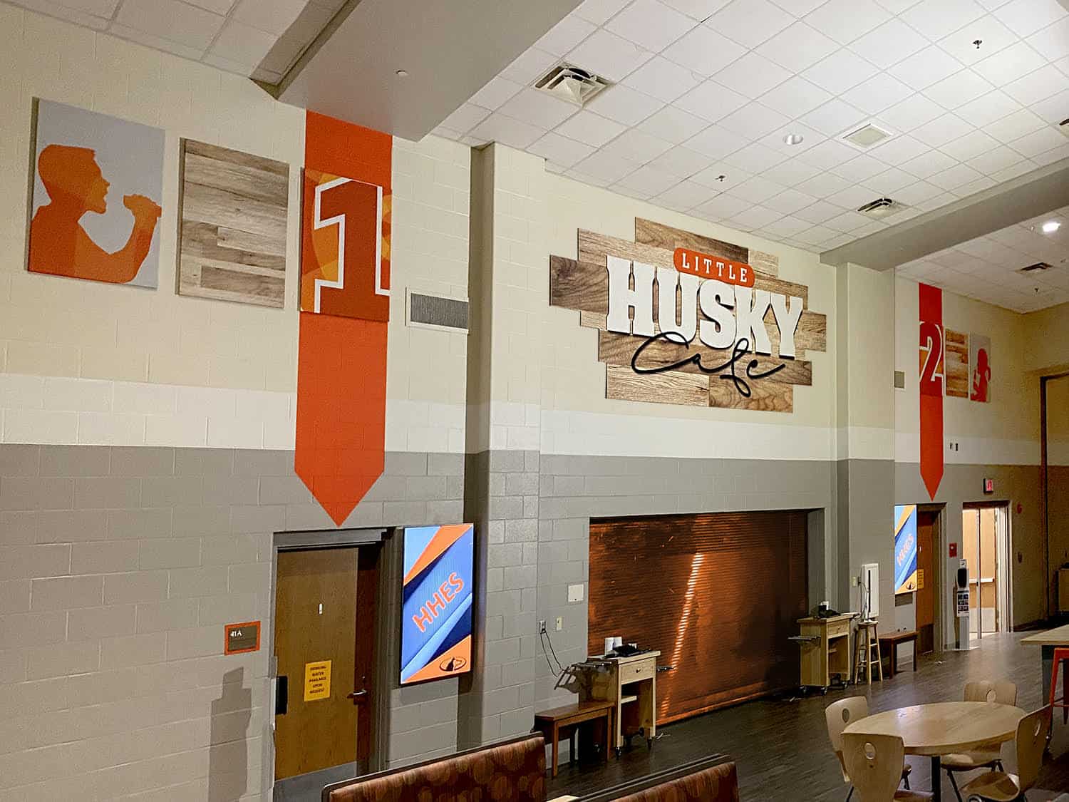 Modern signage display at Little Husky Cafe in Australia.