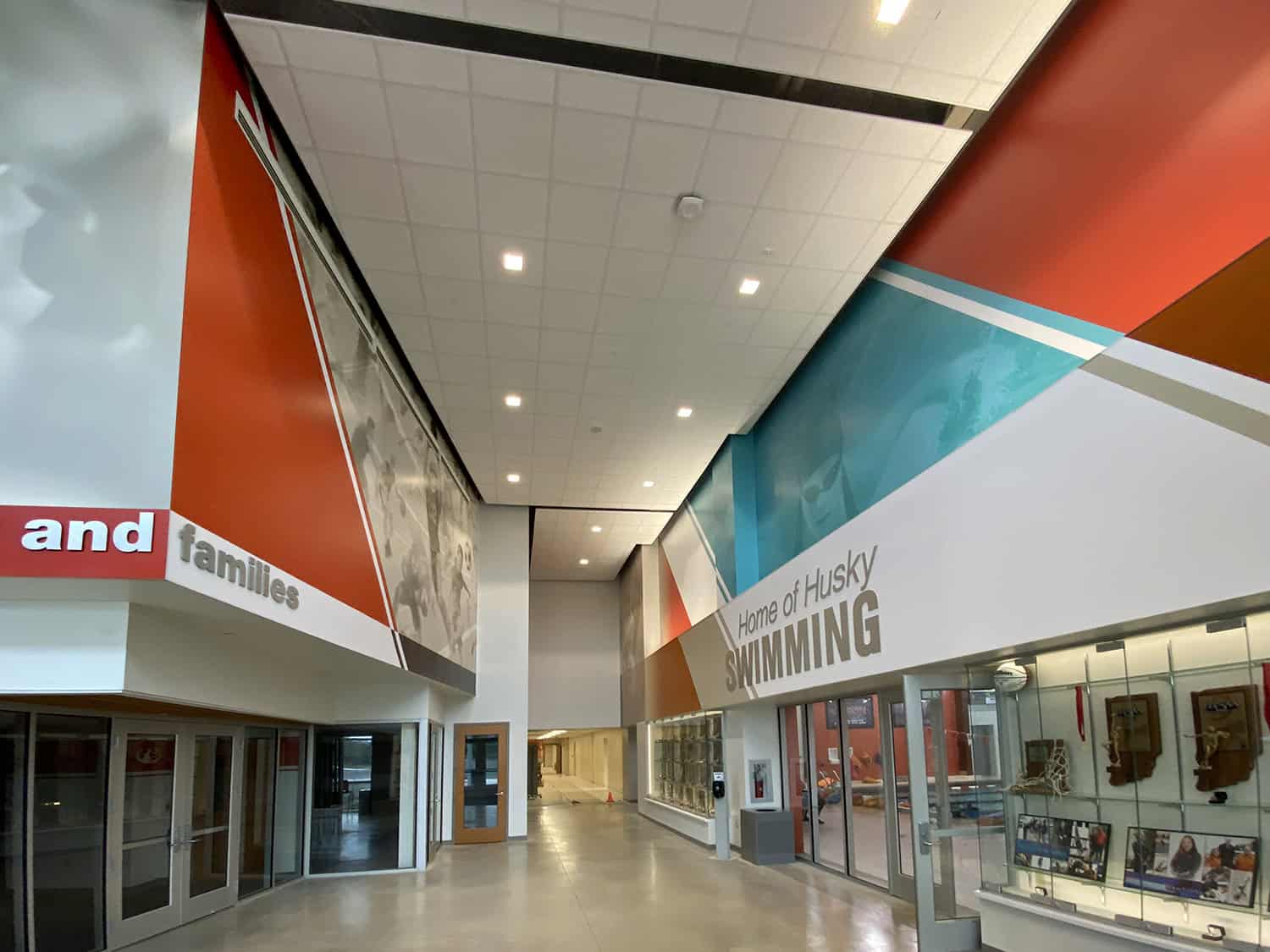 Colourful interior signage showcasing custom wall graphics and branding for a sports complex.