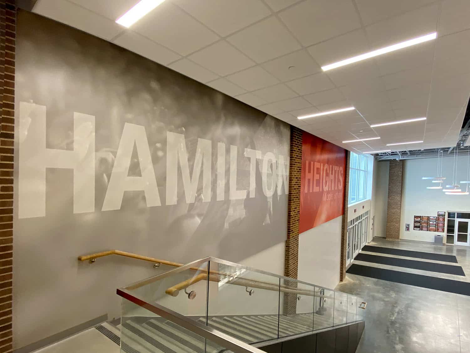Bold signage wall inside a modern building with “HAMILTON” and “HEIGHTS” displayed.