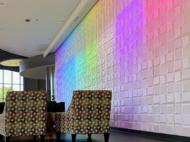 Colourful 3D textured wall feature in modern interior design.