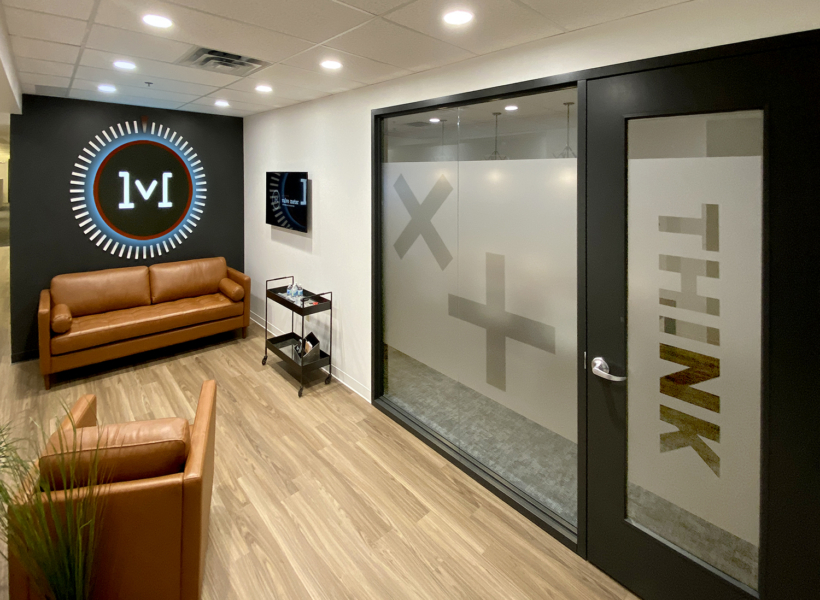 Modern office waiting area with signage and branding for Signworks.