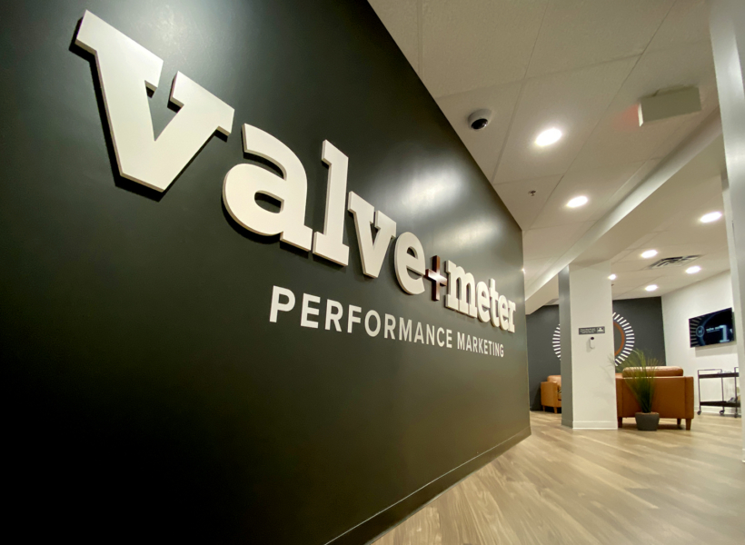 High-quality office lobby signage with 3D branding for Vallve + Meter Performance Marketing.