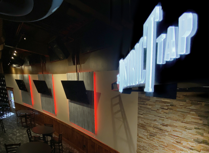 Illuminated neon sign for Signworks, custom LED signage for commercial branding.