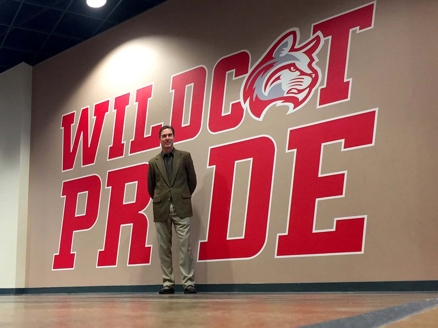 Bold red "WILDCATS PRIDE" sign with cat mascot logo at Signworks.