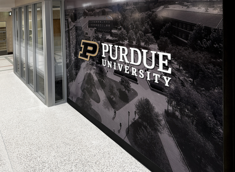 Modern Purdue University branded wall display with campus aerial view.