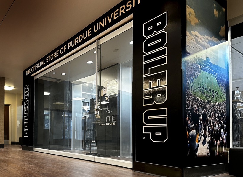 Black and white Purdue University logo signage at the Purdue Official Store.