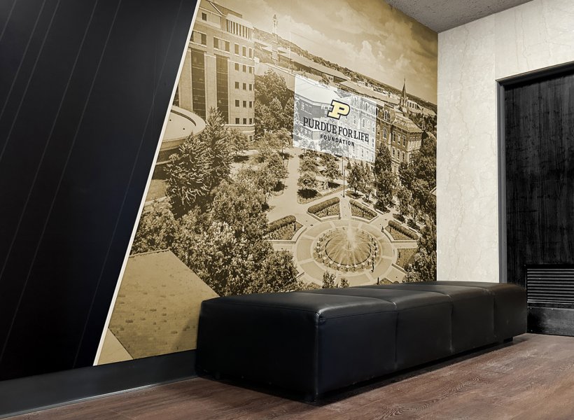 Vintage sepia-toned aerial photo of Purdue University campus with Purdue Fort Wayne Foundation sign, wall decor, interior, artwork, signage, university campus, decorative wall art, historic building, educational institution, mural, college logo signage, student centre design, university branding, academia, campus scenery, university landmark, interior wall decoration, institution branding, corporate signage, academic environment, college campus decor, interior illustration, university spirit display, collegiate aesthetic, educational background, modern university decor, professional interior design.