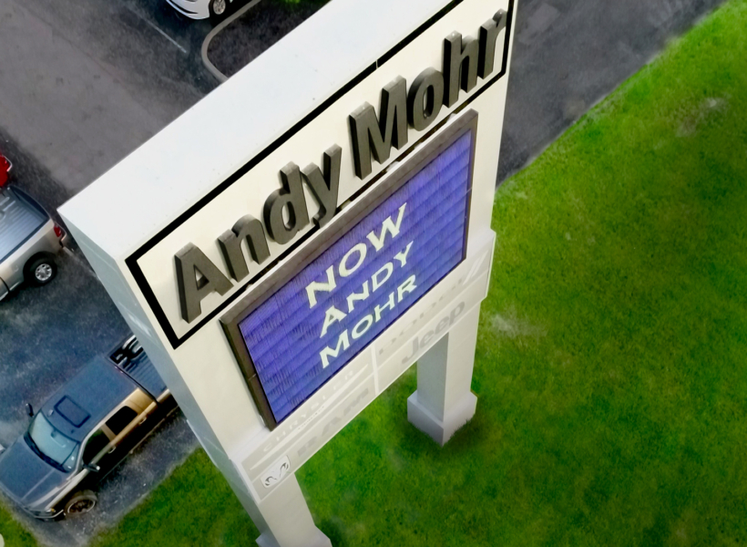 Sign work signage and digital message board at Andys Mowing franchise location in Australia.