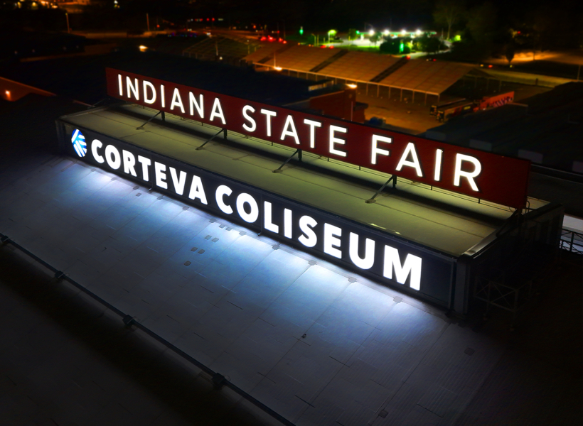 Illuminated Indiana State Fair and Corteva Coliseum sign at night, LED outdoor signage for events, signage solutions Australia.